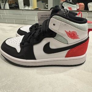 Kids air Jordan 1 mid. Too small for my step son. New with tags
